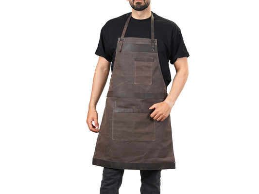 Man wearing a brown leather apron on a white background